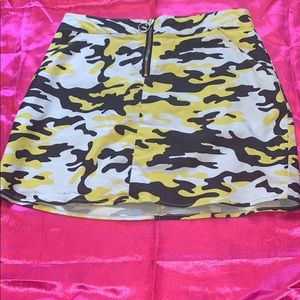 A yellow, grey, and white camouflage skirt